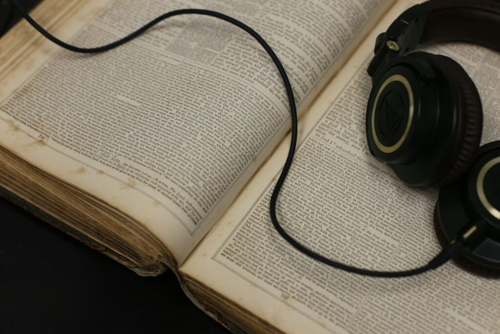 black corded headset on open book